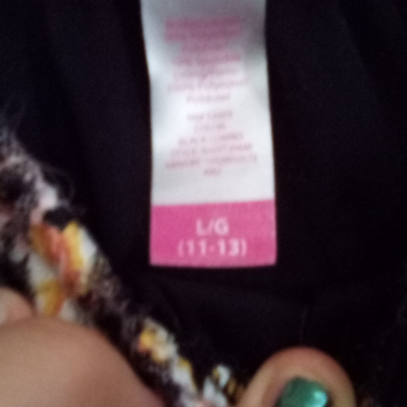 A black dress with flowers on it - Picture 2 of 3